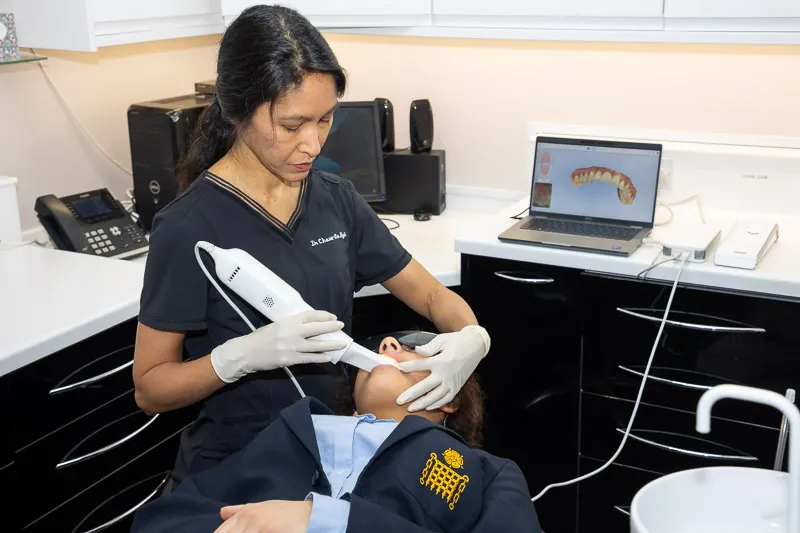 Dr Chaw-Su Kyi carrying out a 3D iTero scan on a patient