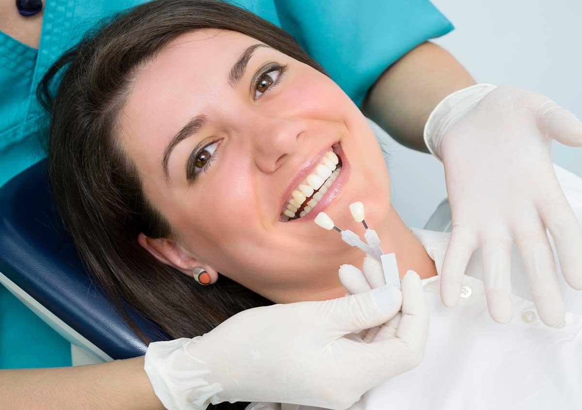 Close-up of a patient's bright, natural-looking porcelain veneers after treatment in West London